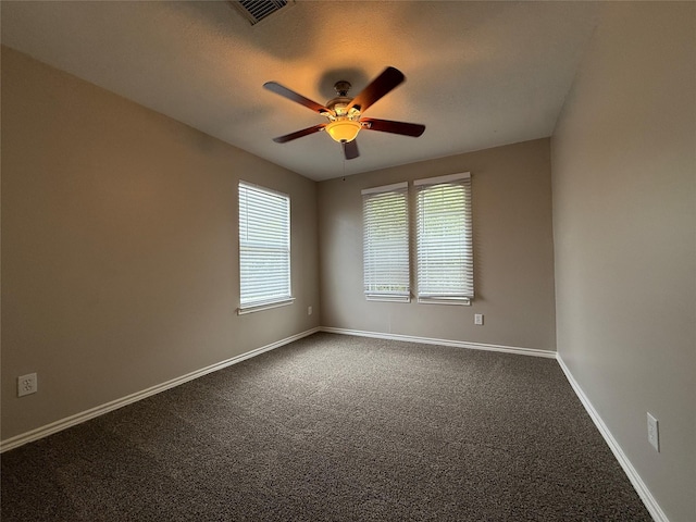2325 Shady Tree Ln, Conroe, TX 77301 - empty room featuring ceiling fan and dark colored carpet