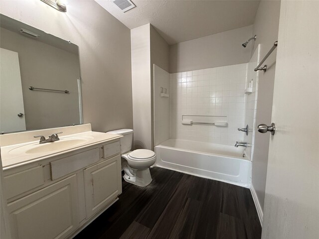 2325 Shady Tree Ln, Conroe, TX 77301 - bathroom with vanity, bathtub / shower combination, and wood finished floors