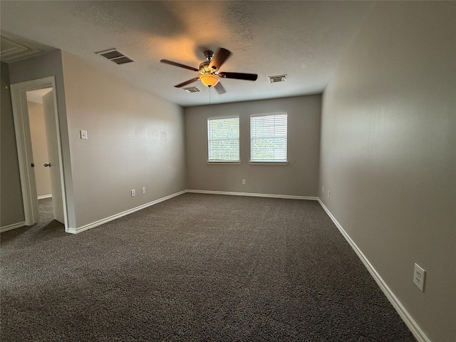 2325 Shady Tree Ln, Conroe, TX 77301 - unfurnished room with a ceiling fan, dark colored carpet, and a textured ceiling