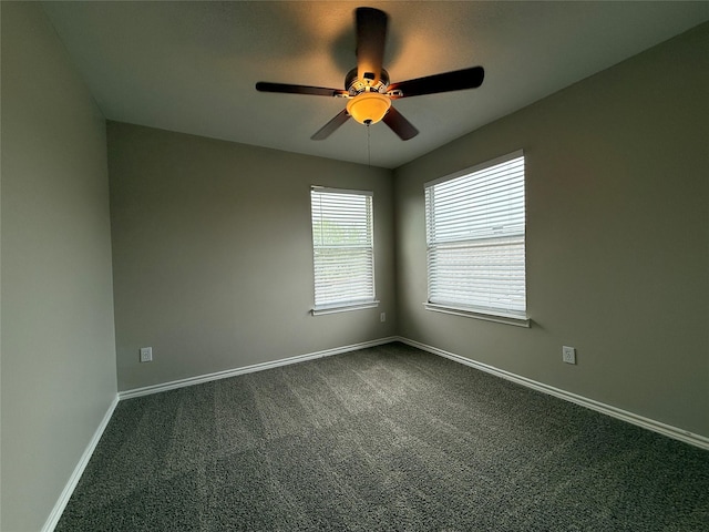 2325 Shady Tree Ln, Conroe, TX 77301 - spare room featuring ceiling fan and dark carpet