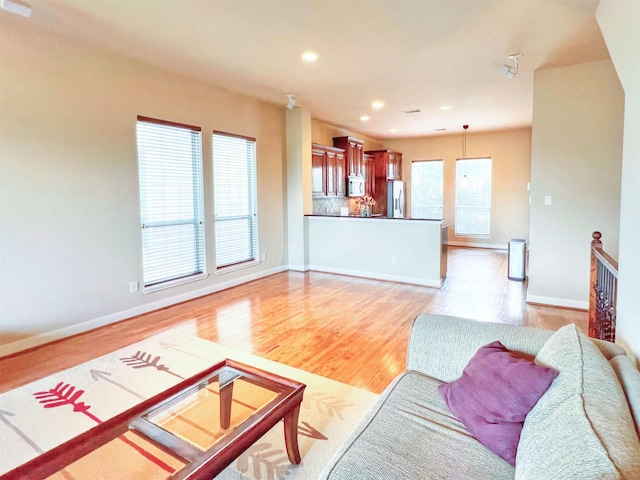 2325 Hutchins St, Houston, TX 77004 - living room with light wood-style floors and recessed lighting