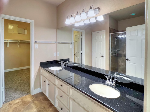 2325 Hutchins St, Houston, TX 77004 - bathroom with a stall shower, double vanity, and a spacious closet