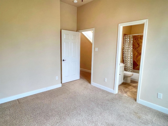 2325 Hutchins St, Houston, TX 77004 - unfurnished bedroom featuring carpet floors and connected bathroom