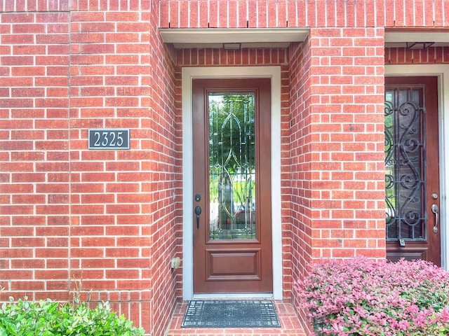 2325 Hutchins St, Houston, TX 77004 - doorway to property featuring brick siding