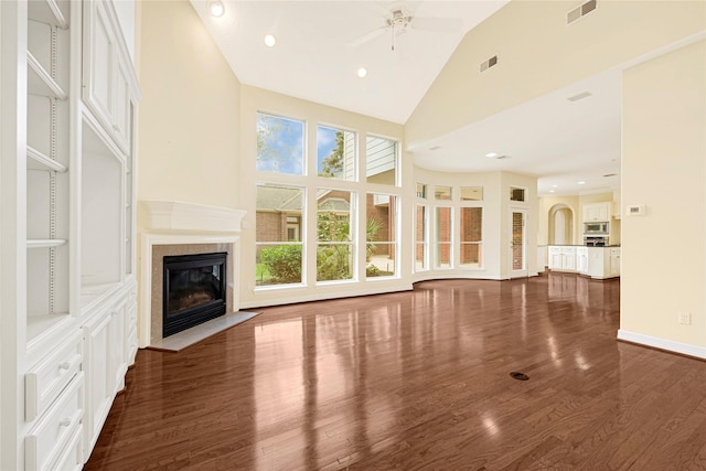 16506 Emilia Ct, Spring, TX 77379 - unfurnished living room featuring a ceiling fan, high vaulted ceiling, wood finished floors, plenty of natural light, and a fireplace