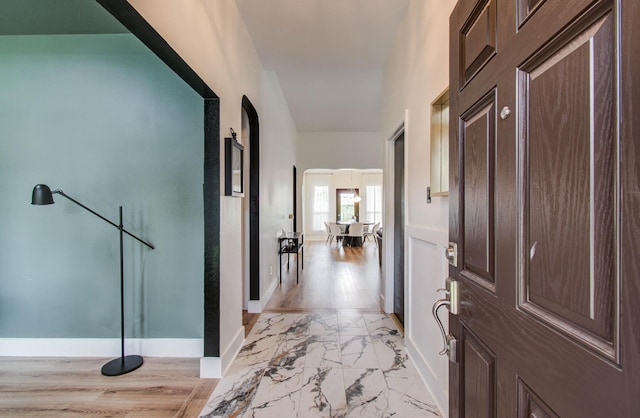 4426 Innsbrook Pl, Sugar Land, TX 77479 - foyer with light marble finish floors and arched walkways
