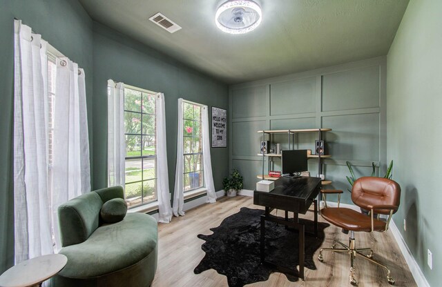 4426 Innsbrook Pl, Sugar Land, TX 77479 - office area with a decorative wall, plenty of natural light, and light wood-style floors