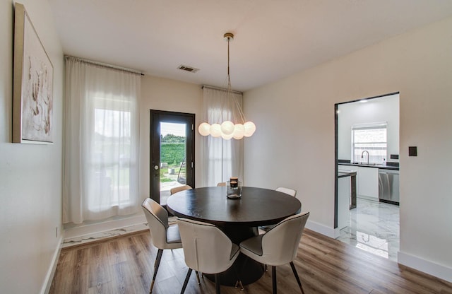 4426 Innsbrook Pl, Sugar Land, TX 77479 - dining space featuring healthy amount of natural light and light wood-style flooring