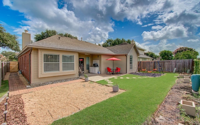 4426 Innsbrook Pl, Sugar Land, TX 77479 - rear view of house with a chimney, a fenced backyard, and a patio