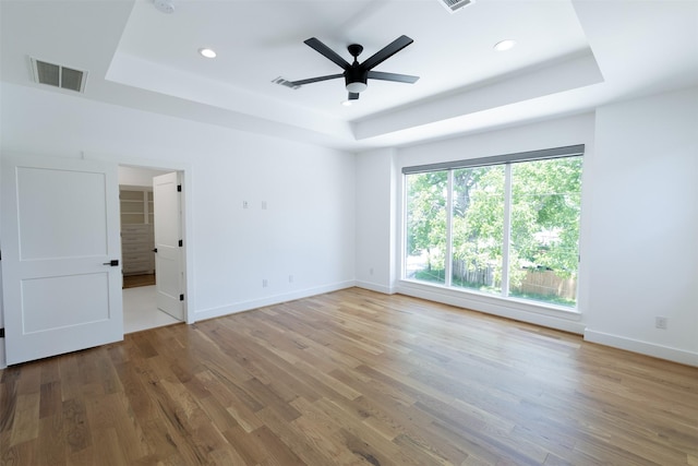 1202 Hamblen St, Houston, TX 77009 - spare room with a tray ceiling, wood finished floors, recessed lighting, and a ceiling fan