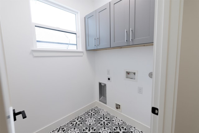 1202 Hamblen St, Houston, TX 77009 - washroom featuring cabinet space, electric dryer hookup, hookup for a washing machine, and tile patterned floors