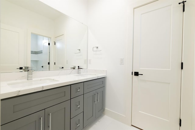 1202 Hamblen St, Houston, TX 77009 - bathroom featuring double vanity and baseboards