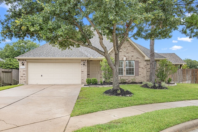 2206 Hollow Bloom Ln, Katy, TX 77494 - view of front of home with brick siding, a shingled roof, driveway, and a garage