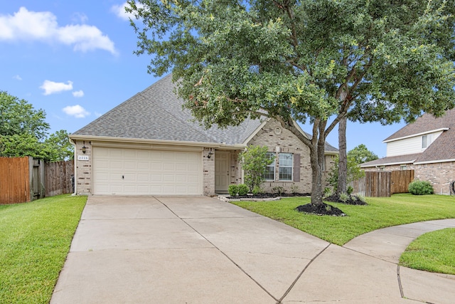 2206 Hollow Bloom Ln, Katy, TX 77494 - view of front of house with brick siding, an attached garage, roof with shingles, and driveway
