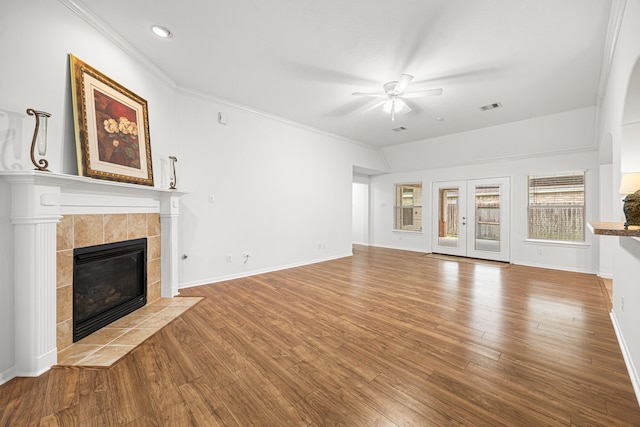 2206 Hollow Bloom Ln, Katy, TX 77494 - unfurnished living room with a fireplace, a ceiling fan, wood finished floors, ornamental molding, and recessed lighting