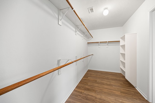 2206 Hollow Bloom Ln, Katy, TX 77494 - walk in closet featuring dark wood-style floors
