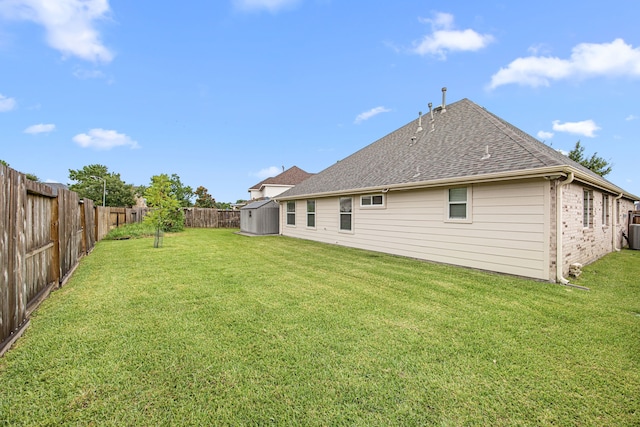 2206 Hollow Bloom Ln, Katy, TX 77494 - fenced backyard featuring a storage unit
