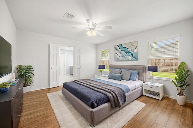 2206 Hollow Bloom Ln, Katy, TX 77494 - bedroom with light wood-style flooring and ceiling fan