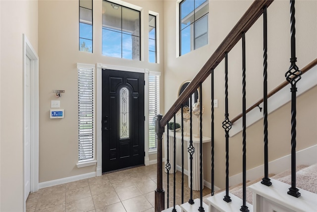 8218 Rustic Cape Dr, Cypress, TX 77433 - tiled foyer entrance with stairway and a towering ceiling