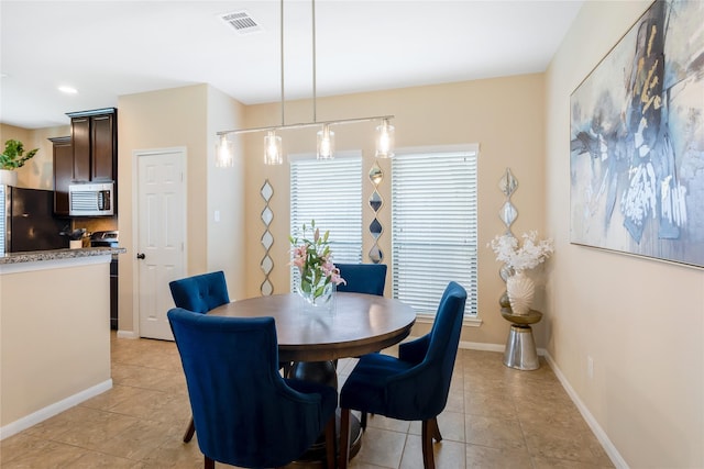 8218 Rustic Cape Dr, Cypress, TX 77433 - dining room with light tile patterned flooring and recessed lighting