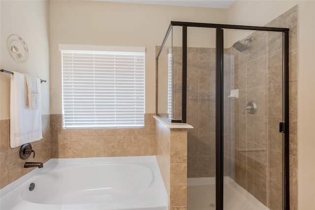 8218 Rustic Cape Dr, Cypress, TX 77433 - bathroom featuring a garden tub and a shower stall
