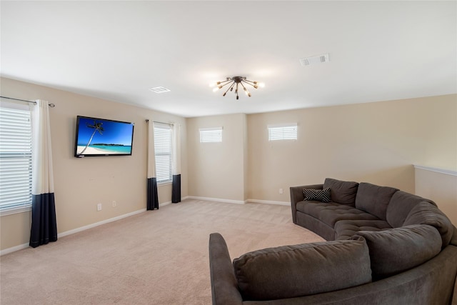 8218 Rustic Cape Dr, Cypress, TX 77433 - living room featuring light carpet and a chandelier
