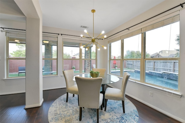 8106 Yarrow Dr, Cypress, TX 77433 - dining room with a chandelier, dark wood-style floors, and plenty of natural light
