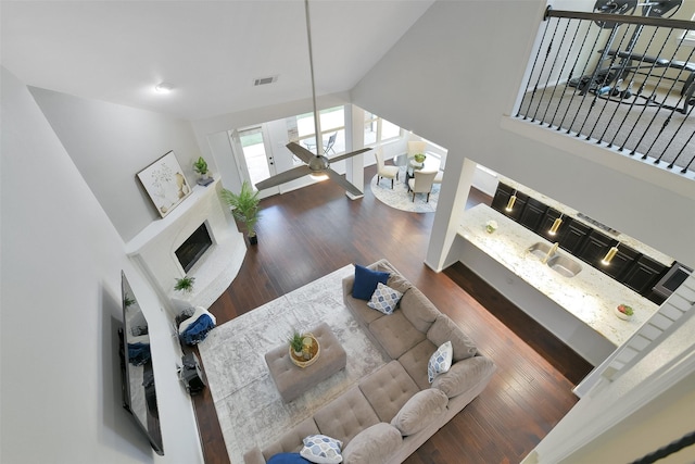 8106 Yarrow Dr, Cypress, TX 77433 - living room featuring wood finished floors and high vaulted ceiling