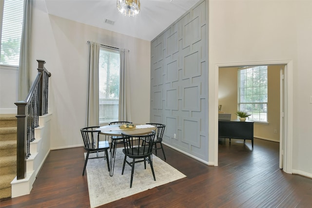 8106 Yarrow Dr, Cypress, TX 77433 - dining space featuring dark wood-style floors, healthy amount of natural light, and stairway