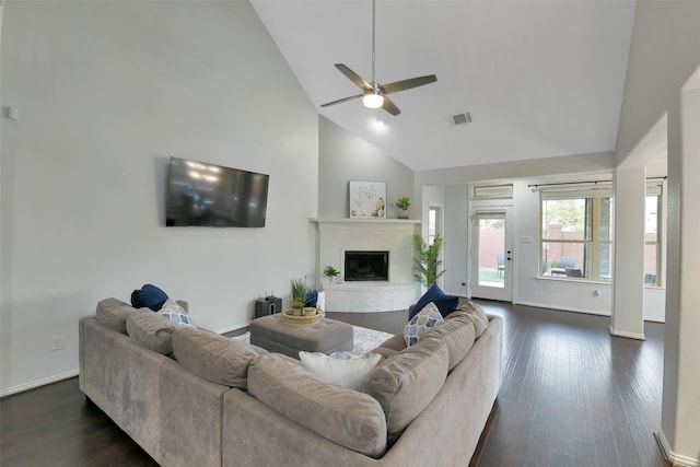 8106 Yarrow Dr, Cypress, TX 77433 - living room with high vaulted ceiling, a ceiling fan, a brick fireplace, and dark wood-style flooring