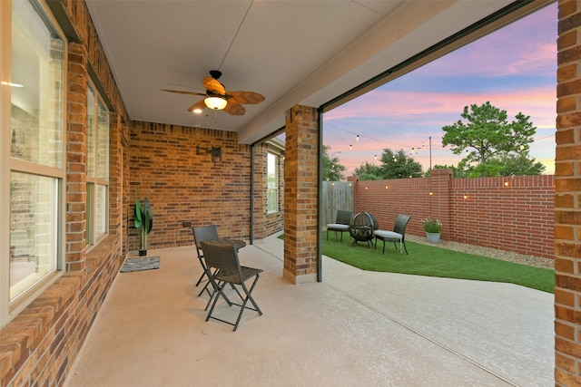 8106 Yarrow Dr, Cypress, TX 77433 - fenced backyard with a ceiling fan and a patio area