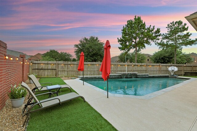 8106 Yarrow Dr, Cypress, TX 77433 - pool at dusk featuring a fenced backyard and a patio