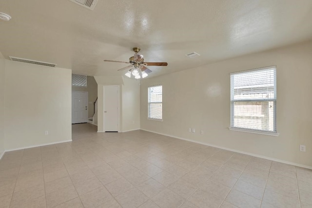 12807 Maybank Shores Ct, Houston, TX 77045 - empty room featuring a ceiling fan and baseboards