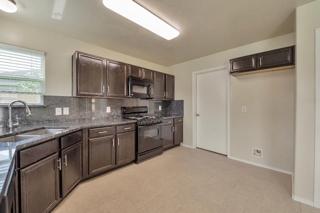 12807 Maybank Shores Ct, Houston, TX 77045 - kitchen featuring black appliances, dark brown cabinets, backsplash, and dark stone countertops