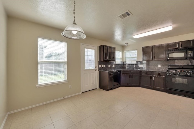 12807 Maybank Shores Ct, Houston, TX 77045 - kitchen featuring black appliances, a textured ceiling, backsplash, dark brown cabinets, and decorative light fixtures