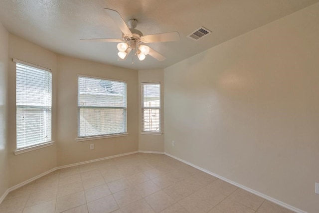 12807 Maybank Shores Ct, Houston, TX 77045 - unfurnished room featuring ceiling fan and light tile patterned floors