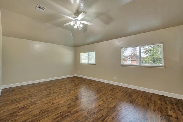 12807 Maybank Shores Ct, Houston, TX 77045 - unfurnished room featuring dark wood-type flooring, ceiling fan, and lofted ceiling