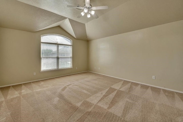 12807 Maybank Shores Ct, Houston, TX 77045 - unfurnished room with light colored carpet, ceiling fan, and vaulted ceiling
