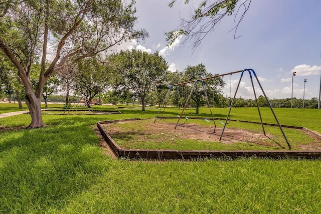 12807 Maybank Shores Ct, Houston, TX 77045 - community jungle gym featuring a lawn