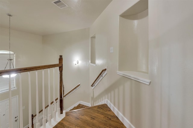 12807 Maybank Shores Ct, Houston, TX 77045 - stairs featuring wood finished floors and baseboards