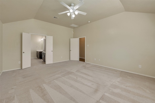 12807 Maybank Shores Ct, Houston, TX 77045 - unfurnished bedroom featuring vaulted ceiling, light carpet, ensuite bath, and a ceiling fan