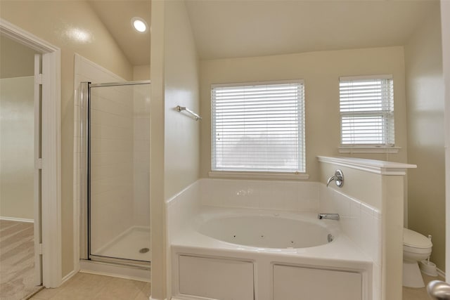 12807 Maybank Shores Ct, Houston, TX 77045 - full bath featuring a jetted tub, a stall shower, lofted ceiling, and tile patterned flooring