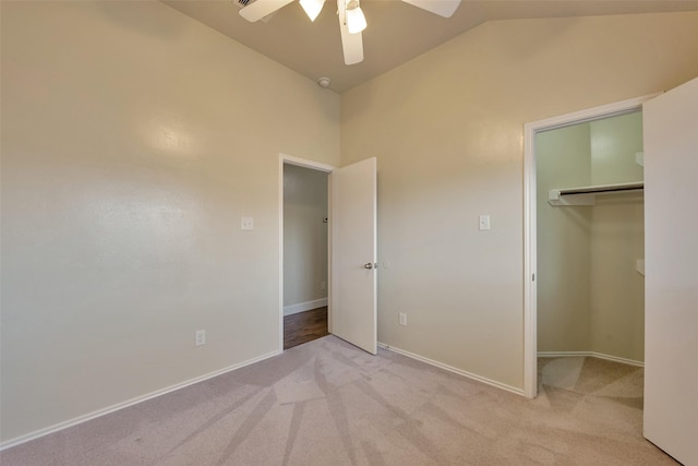 12807 Maybank Shores Ct, Houston, TX 77045 - unfurnished bedroom with vaulted ceiling, light colored carpet, a walk in closet, and a ceiling fan