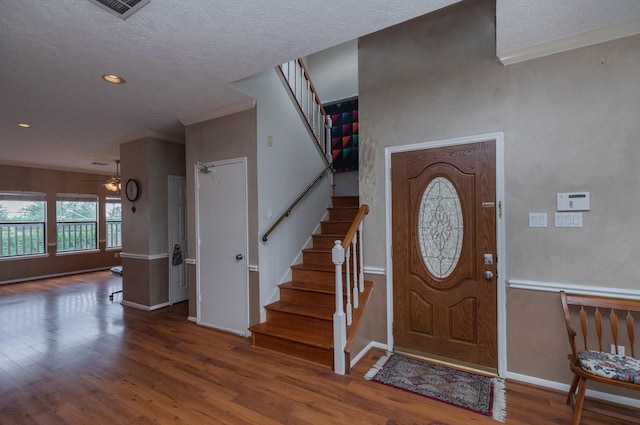 2601 Sailboat Dr, Houston, TX 77058 - foyer entrance featuring wood finished floors, stairs, ceiling fan, a textured ceiling, and recessed lighting
