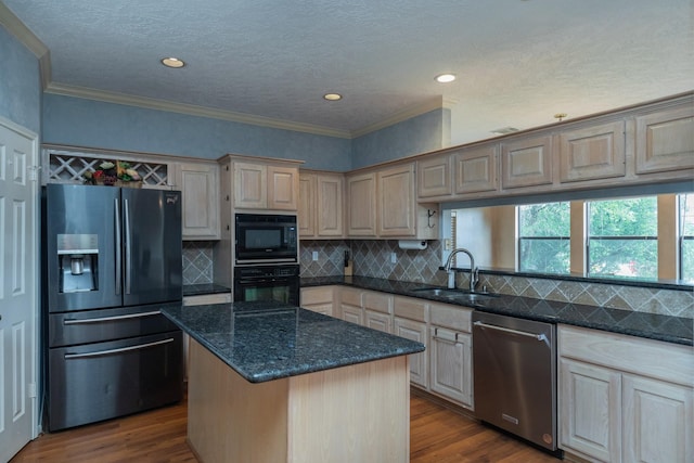 2601 Sailboat Dr, Houston, TX 77058 - kitchen with black appliances, ornamental molding, dark wood-type flooring, a kitchen island, and dark stone counters