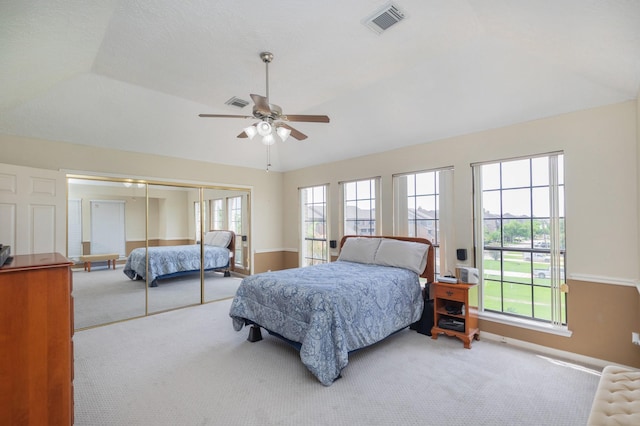 2601 Sailboat Dr, Houston, TX 77058 - carpeted bedroom with multiple windows, a closet, and a ceiling fan