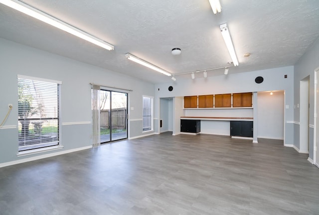 2601 Sailboat Dr, Houston, TX 77058 - unfurnished living room with a textured ceiling and wood finished floors