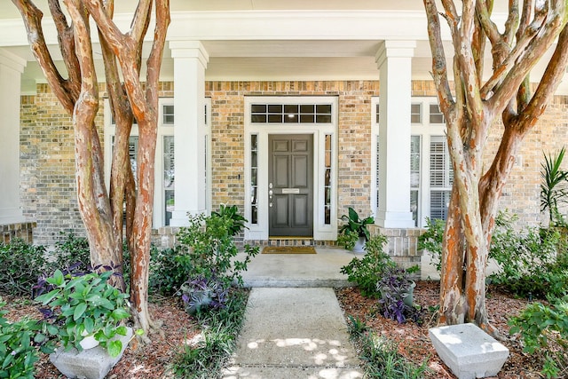 2442 Chimney Rock Rd, Houston, TX 77056 - view of exterior entry with a porch and brick siding