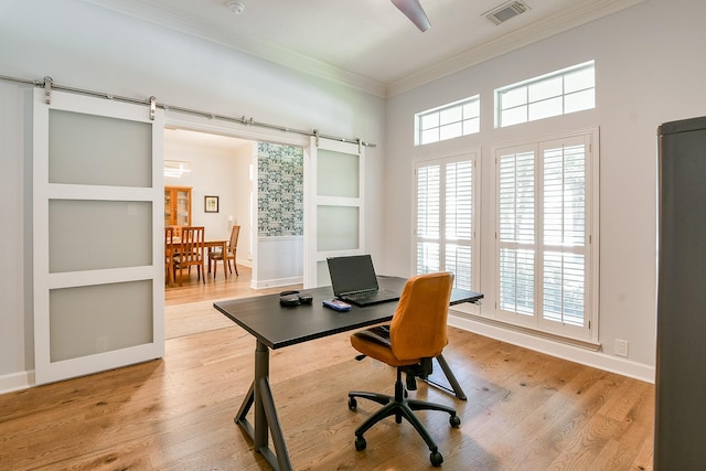 2442 Chimney Rock Rd, Houston, TX 77056 - office area with a barn door, ornamental molding, and light wood-style flooring