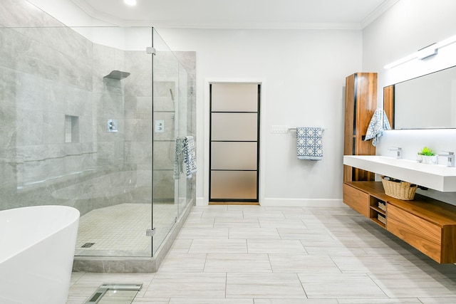 2442 Chimney Rock Rd, Houston, TX 77056 - full bathroom featuring a soaking tub, crown molding, a stall shower, and vanity